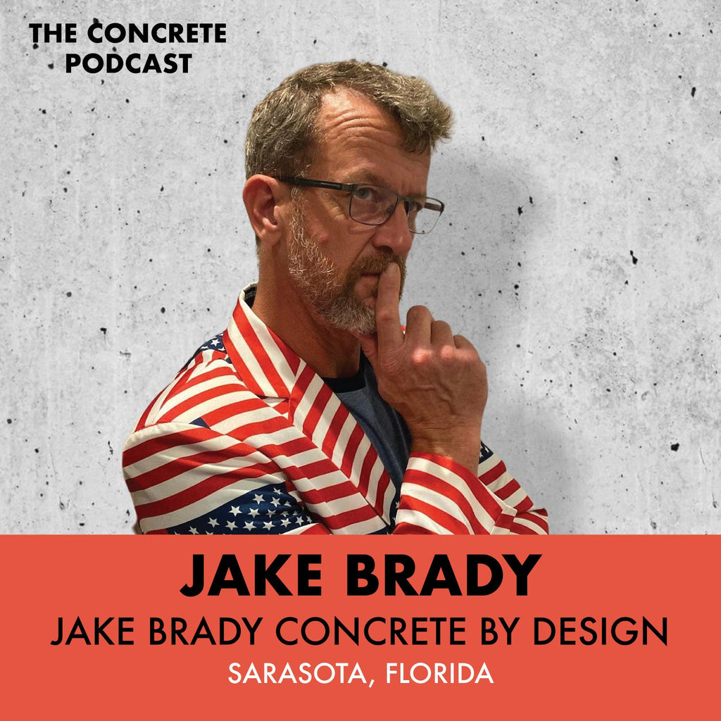Jake Brady of Concrete By Design showcasing a custom-crafted concrete countertop in his Sarasota, Florida studio.