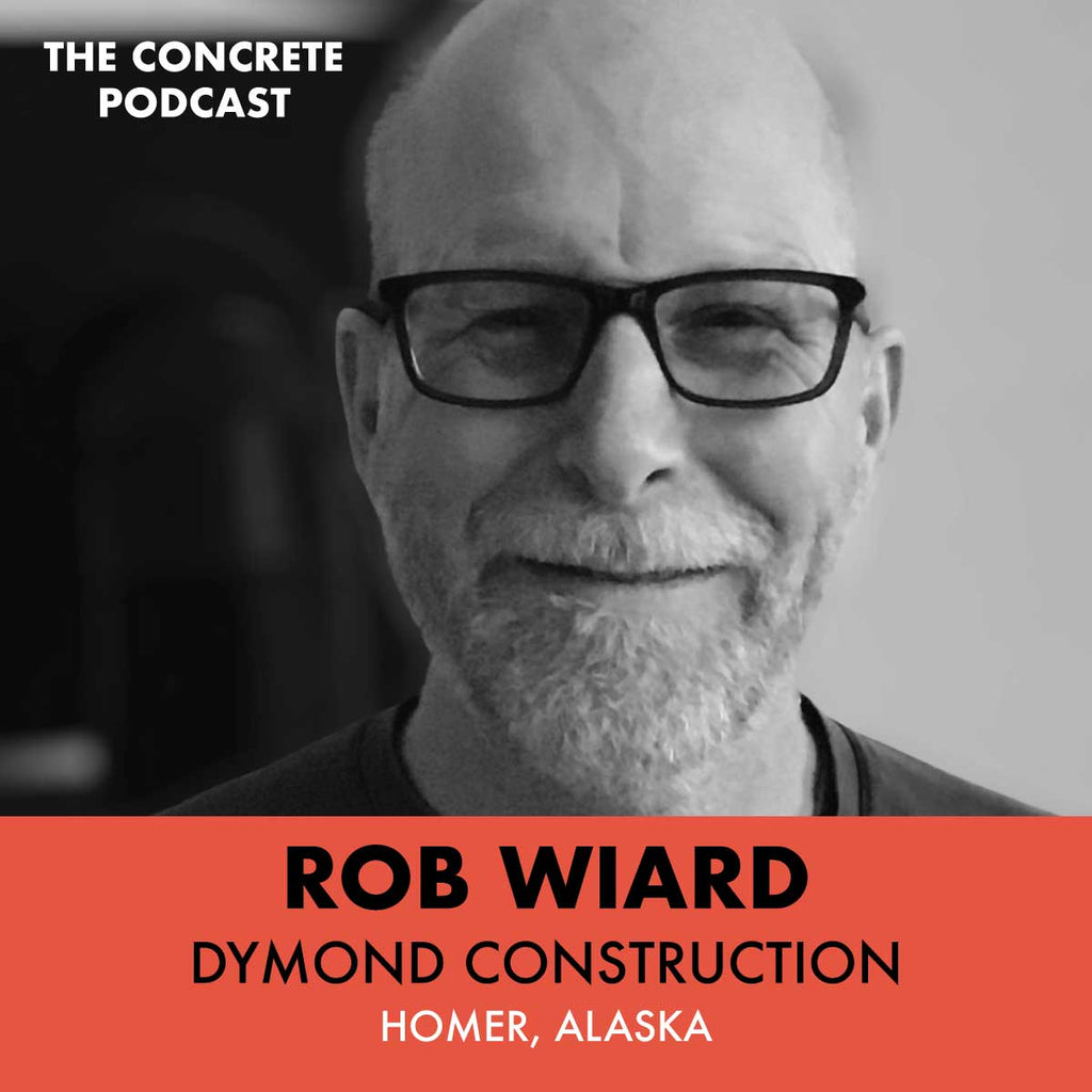 Rob Wiard of Dymond Construction working on a custom concrete countertop in his Homer, Alaska workshop, showcasing craftsmanship in a remote setting.