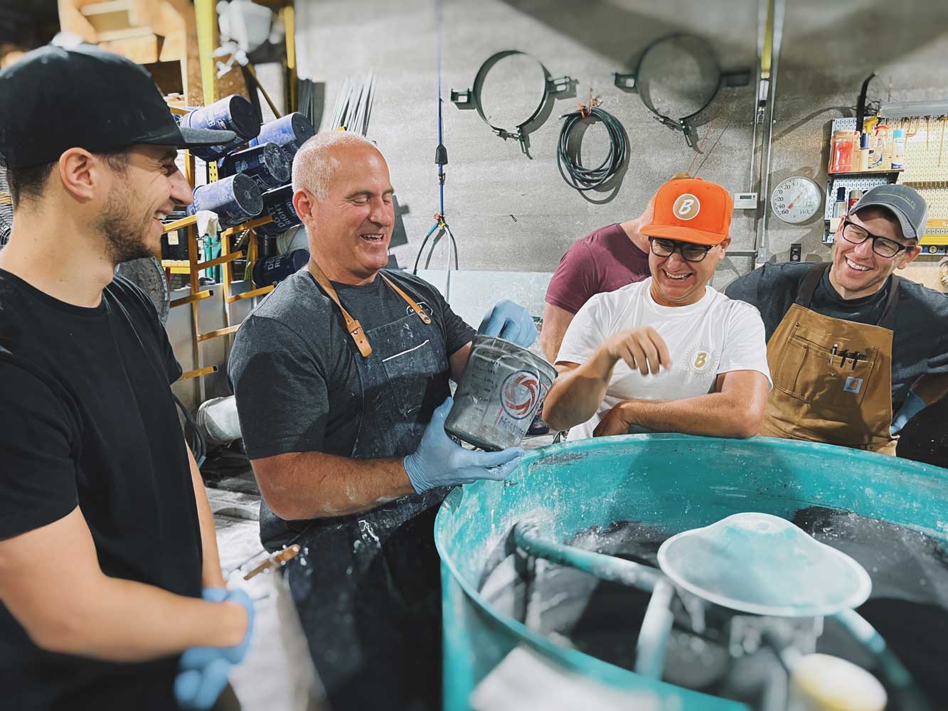 Jon Schuler showing Concrete Design School class attendees how to mix Kodiak Pro Maker Mix GFRC for concrete countertops 