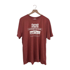 Front of red Kodiak Pro and Concrete Design School Concrete Is Hard t-shirt on a hanger